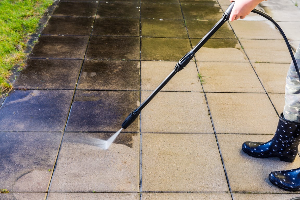 Detail of cleaning terrace with high-pressure water blaster